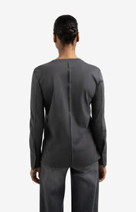 Jersey top with woven cuffs and slit detail